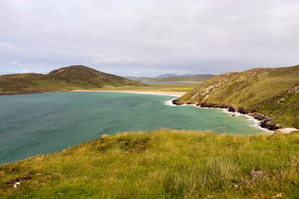 a body of water with hills around it