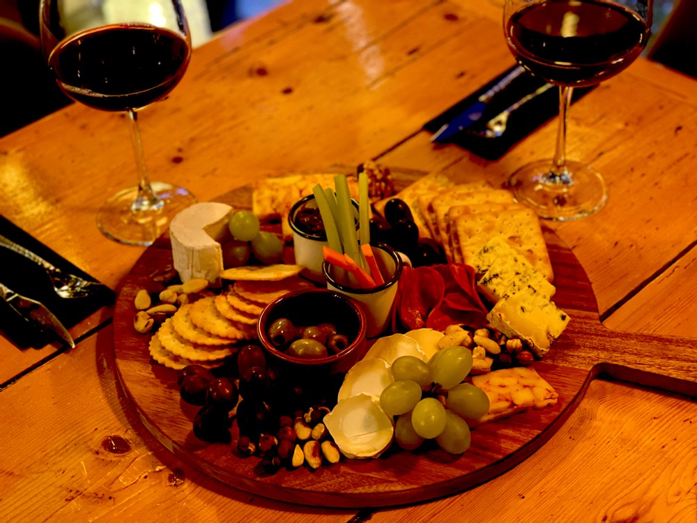Red wine, brie cheese, olives, chorizo, cheese board, merlot, white wine, nuts, chilli cheese, grapes stilton