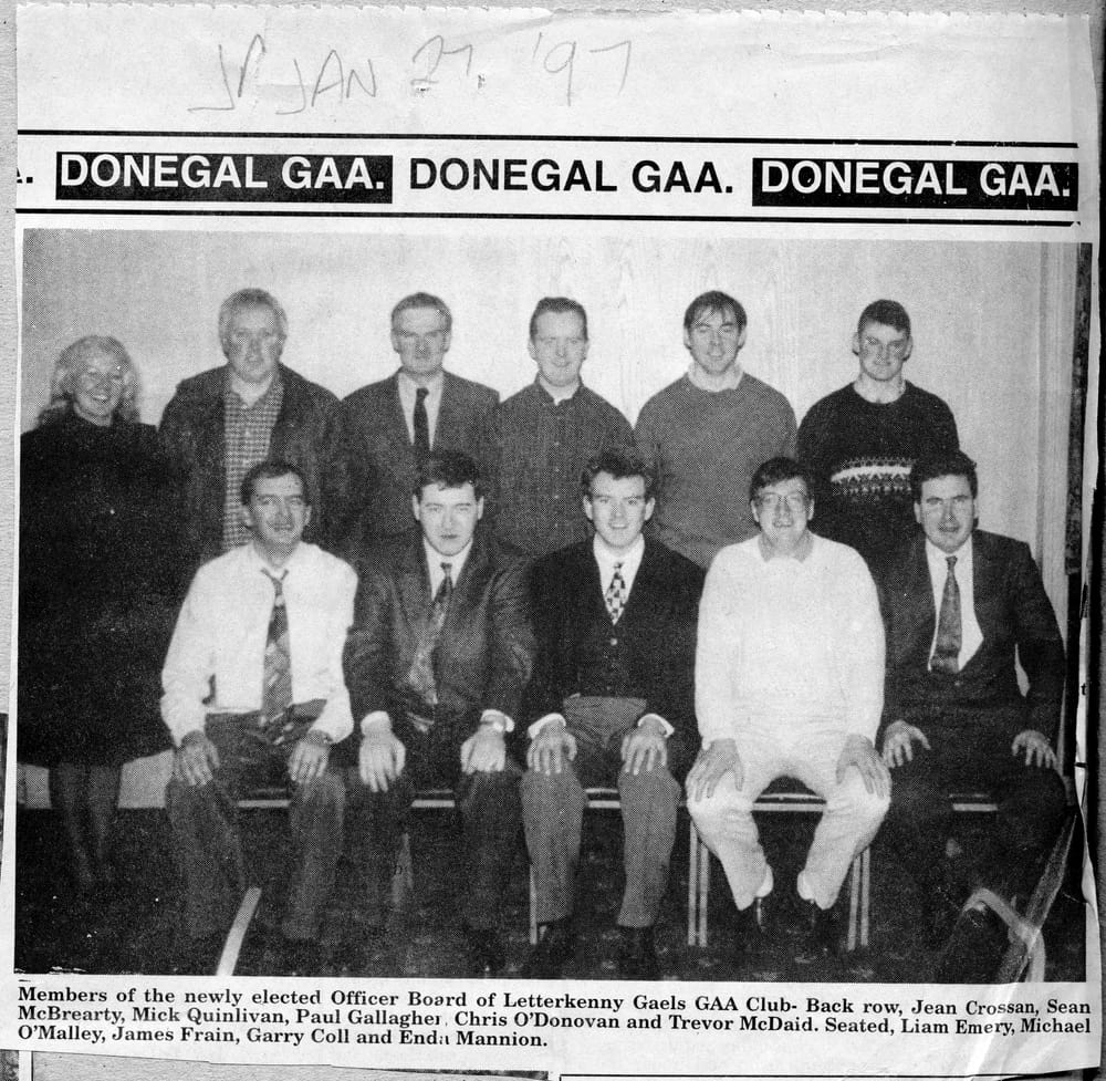 a group of men posing for a photo