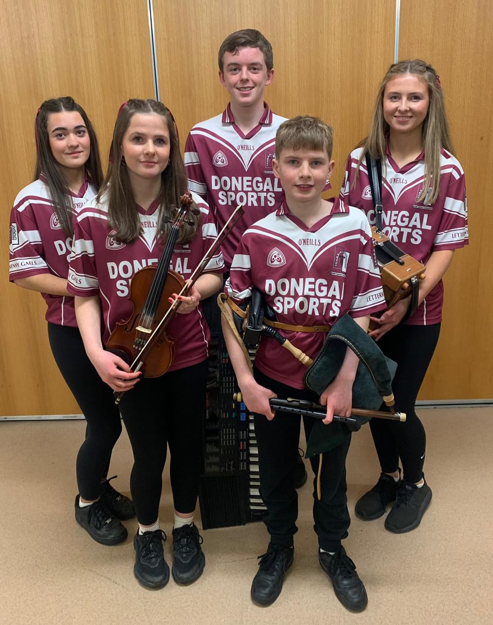 a group of people holding instruments